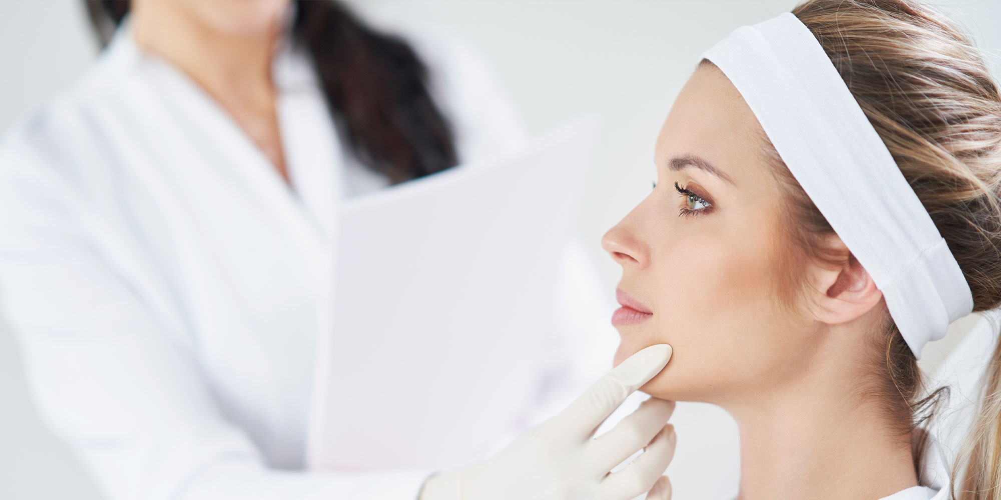 botox patient getting face examined
